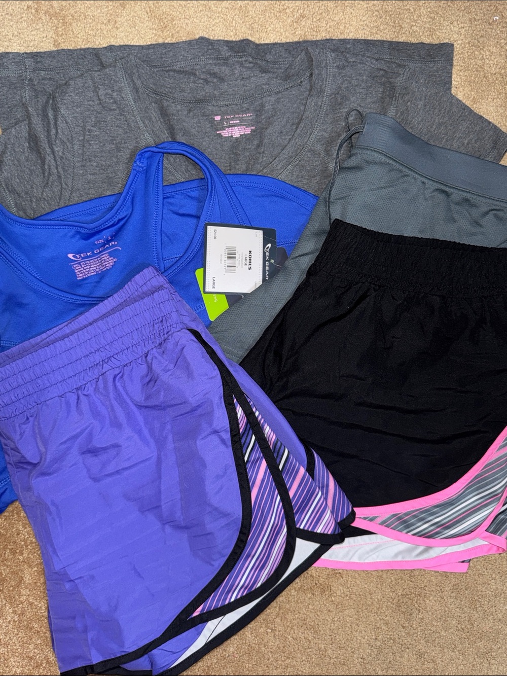 tek gear set of athletic wear- includes 4 shorts, 1 vneck top, and 1 NWT tank